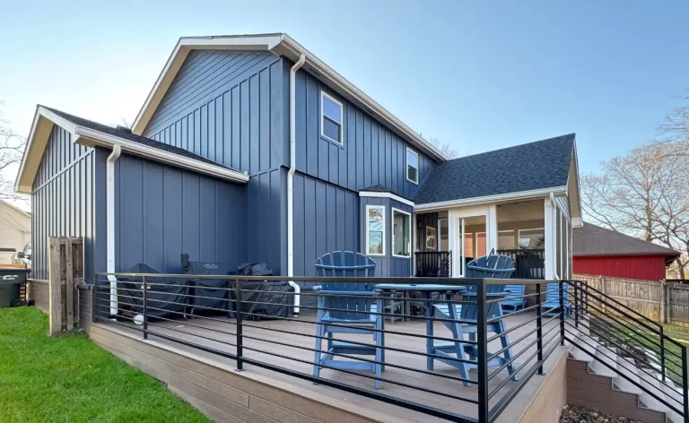 Home renovation with painted siding, new deck and updated addition
